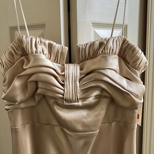 ABS brand; new with tags. Formal gown. Goldish/beige color. Size 8. Retail $415